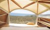 Keeping molded components to a minimum, the pair first designed a lightweight frame and then enclosed the structure with taut fabric and sheets of Jobert Okume marine plywood. Photo of A 44-Square-Foot Prefab Trailer modern home