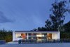 Modern home with Exterior, House Building Type, Prefab Building Type, and Glass Siding Material. A self-learning heating and power system inside the home utilizes a series of radio sensors inside and outside, as well as on the home's electric cars, to constantly compare and learn, not only adjusting to temperature differences and behavioral patterns but forecasting them. If it's going to be warm tomorrow, the home will anticipate when to stop heating the home and divert the overflow to the Le Corbusier building. Researchers at the University of Stuttgart studying the home have nearly nine months of data to work on, and after a family begins living in the home this spring, they'll be able to improve the system's performance with real-world data. Photo of Prefabs Assembled in 6 Weeks or Less