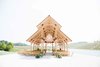 The large open-air pavilion, also overlooking the lake, echoes the retreat’s timber construction and natural hues. It hosted the architect’s wedding ceremony in the year of its completion, 2014. Photo 8 of Off-Grid Retreat modern home