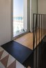 Librizzi spoke of the process behind conceptualizing and building the stairs as a means of turning the interior into a "machine for the panorama." Photo of A Mind-Blowing, Mondrian-Esque Staircase modern home
