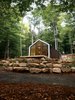 Modern home with Exterior, Cabin Building Type, House Building Type, and Gable RoofLine. Located about 100 miles north of Toronto, the Bunkie overlooks the Lake of Bays and is adjacent to the client’s house. This Bunkie is clad in wood reclaimed from a barn. A patio extends outwards, enabling the client to exercise outdoors when weather permits. Photo of High-Tech Prefab Outbuilding is a Surprisingly Peaceful Retreat
