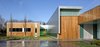 "The most challenging aspect of the project was the client’s directive to 'design an art gallery we can live in,'" says architect Jeff Dolezal of local firm Tack Architects. Though the house is quite large—over 10,000 square feet—it was constructed with green design principals in mind. It features low-VOC paints and interior finishes, locally sourced materials, blown in soy-based spray foam exterior insulation, skylights and solatubes for natural daylighting, and FSC certified lumber, and LED light fixtures. The exterior is clad in zinc and cedar. Photo of Omaha Art-Inspired House modern home