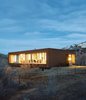 Modern home with Exterior, House Building Type, Cabin Building Type, Flat RoofLine, and Wood Siding Material. In the land of large mountain lodge wannabes, two California natives tuck Utah’s first LEED for Homes–rated house onto the side of Emigration Canyon. Photo by Dustin Aksland Photo of Modern Homes Throughout the Southwest