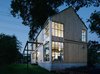 Modern home with Exterior, House Building Type, Gable RoofLine, and Wood Siding Material. The exterior features vertical, untreated cedar panels. “We tried to use materials that are beautiful in their natural state without excessive treatment or finishing,” Pavonetti says. Photo of Bright, Personality-Filled Home Built on a Budget in Austin