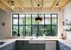 Modern home with Kitchen and Vessel Sink. In the kitchen, the couple found barely used appliances instead of new ones to save money. The cabinetry and butcher block counters are from Ikea. Photo of Bright, Personality-Filled Home Built on a Budget in Austin
