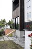 Solbjør and his team utilized traditional Japanese techniques to create the midnight-black cedar exterior. Leftover wood from the owner’s farm was charred with charcoal and then stained with ink to add additional depth and a rich tone. Photo 2 of Charred Cedar modern home