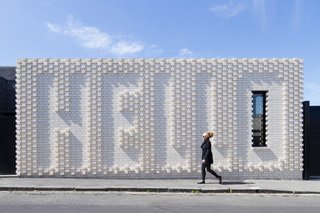 This Victorian-era home in Melbourne, renovated by OOF! Architecture, maintains privacy from the street, but does so in an unusually "friendly" manner—with a giant brick wall that spells out "Hello," a collaboration with local artist Rose Nolan. The residents wanted their house to appeal to passersby, since it sits on a well-trafficked block near a café.