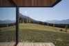 Overhangs like this one are a simple way of controlling the amount of daylight that comes in to the living spaces. They shield the interior from the glare and heat of the high summer sun, but capture light and passive warmth when it is low during winter. Photo 5 of Lake Hawea Courtyard House modern home
