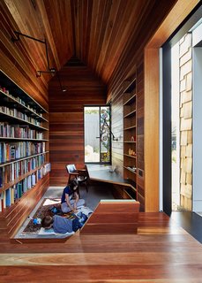 The library is lined in reclaimed spotted gum that Maynard says “brings with it wisdom from its previous life.” A stained glass window by Leigh Schellekens makes the contemplative room feel like a domestic chapel.