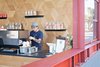 Modern home with Dining Room and Bar. On a busy corner in San Francisco's lively Mission District, Linea Caffe packs a big punch in a small space. Occupying just 300 square feet, the shop makes room for both a coffee bar and waffle counter, staples of the quirky cafe. Also the work of envelope Architecture + Design, Linea employs cool concrete and stainless steel for the food side of the shop, smartly contrasted with the warm oak counter and geometric oak plywood wall of the coffee side. The tiny interior is standing room only, but the industrial steel window frame offers a utilitarian platform for leaning and resting beverages. 3417 18th Street Photo of The 10 Best-Designed Coffee Shops in San Francisco