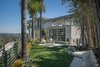 2,200 square feet of outdoor space wraps the home, and nearly every room is accessibly by terrace. Photo of House in the Los Angeles Hills Inspired by California Modernists modern home
