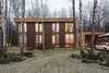 Though the house sits cozily at the back of a birch forest clearing, Zhidkov says no trees were cut during construction. Photo of House in Moscow modern home