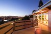 Modern home with Outdoor and Large Patio, Porch, Deck. The painted-gray concrete deck, edged with quarter-inch thick steel railings, offers sweeping views of the city. Photo of This Home's Design Took 72 Drafts to Get Right
