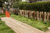 A small fence in the yard echoes the posts that support the new master suite. Photo of 30+ Best Modern Fences modern home