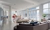 To maximize space, several vertical HVAC units were removed and replaced with energy-efficient units that are cleverly concealed in the ceiling. White Ardex concrete flooring is used throughout the common living spaces. Photo of A Bright Brooklyn Loft with an Envy-Inducing Walk-In Closet modern home