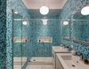Modern home with Bath Room and Mosaic Tile Wall. Bold color is embraced in the home’s first bathroom, with tilework by Trend Mosiacs. Faucets are by Grohe and vanities are by Hastings. A Flos Glo-Ball pendant light illuminates the space. Photo of A Bright Brooklyn Loft with an Envy-Inducing Walk-In Closet