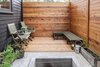The gap between the house and the fence creates a small patio with space for raised bed vegetable gardening. Photo of 30+ Best Modern Fences modern home
