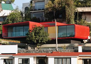 One of Rojkind’s first commissions, in 2001, was a rooftop apartment for a ballerina above her father’s 1960s-era house in the Mexico City suburb of Tecamachalco. Dissatisfied with the look of the Cor-Ten steel exterior, Rojkind hired auto-body workers to finish it with a coat of red automotive paint.