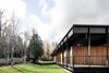 “In a way, we’ve grounded the house, incorporating topography as a main component of the composition from a more abstract box initial concept,” Carle explains. Photo 2 of The Phoenix modern home