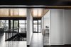 In addition to adjusting the windows, Carle dislocated all wall partitions from the main structure of the house to create a more open feel. “This way, we’re going back to the mythical plan libre dogma of those days, as a wink to our ancestors,” the French-Canadian architect jokes. Photo 3 of The Phoenix modern home