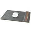 If you’re adverse to adding more accessories to an already-cluttered workspace, small touches like indentations for spare batteries in the keyboard tray, and a pen-holder in the mouse pad, are designed to aid organization. Photo of Streamlined Wood-and-Leather Desk Accessories modern home