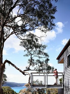 The cantilevered deck juts out from the home. “You really feel like you’re floating,” Harnkess says.