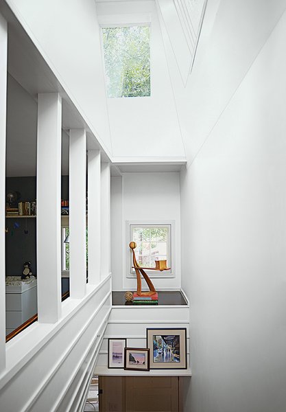 An alcove in the stairwell displays a white ash sculpture by Bradley.