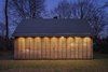 Modern home with Exterior, House, Cabin Building Type, Shingles Roof Material, and Wood Siding Material. When the shutters are closed, the house assumes an introverted character. Photo 10 of Utrecht Cabin
