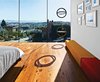 Modern home with Bedroom, Bed, and Medium Hardwood Floor. The LC4 lounge is by Le Corbusier, Charlotte Perriand, and Pierre Jeanneret for Cassina. Operable porthole windows on the east facade offer ventilation. Photo of Our Favorite Bedrooms
