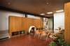 Modern home with Living Room, Wood Burning Fireplace, Brick Floor, and Standard Layout Fireplace. The living room features two side chairs and an end table by Edward Wormley for Dunbar and a bronze screen designed by Harold Balazs. Photo of 47+ Midcentury Modern Homes Across America