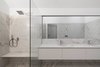Modern home with Bath Room, Marble Counter, Undermount Sink, Marble Floor, and Enclosed Shower. The bathrooms are lined in luxurious Estremoz marble. Photo 7 of House of Four Houses