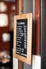 The café's blackboard menu lists many global favorites such as an espresso, Americano, and iced coffee. Apparently some of the best coffee around is brewed here. Hotel guests are treated to a complimentary organic breakfast. Photo by: Martin Kaufmann Photo of World's Smallest Hotel and Café in Copenhagen modern home