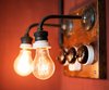 Old-fashioned filament lightbulb fixtures hang on the wall. Photo by: Martin Kaufmann Photo of World's Smallest Hotel and Café in Copenhagen modern home