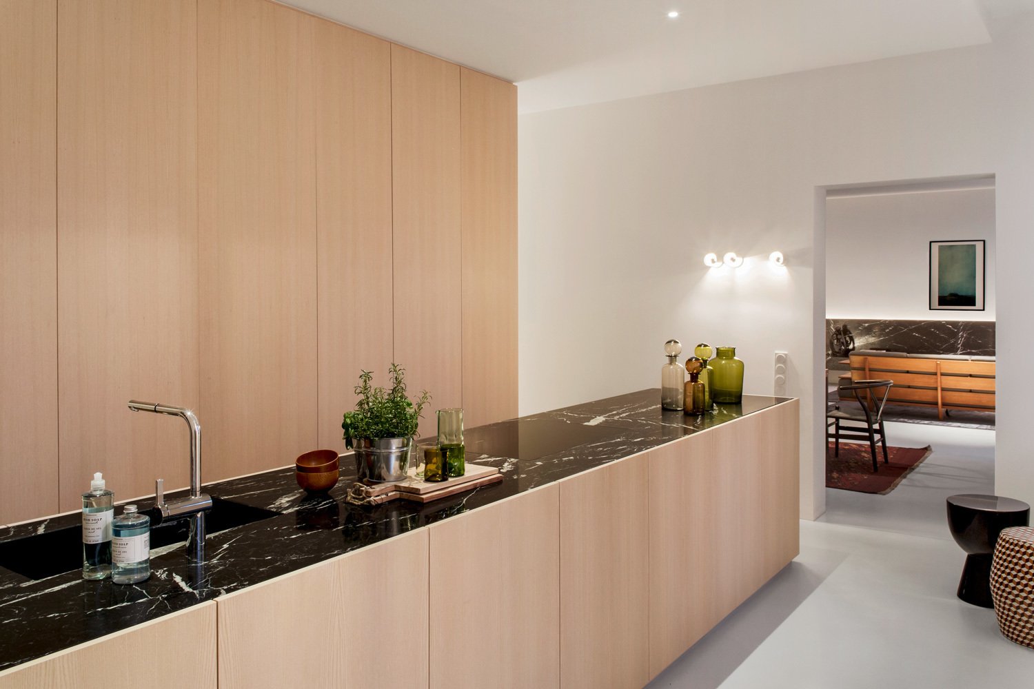 Marble is also used on the kitchen countertops. There are no visible door handles in the entire apartment—including the refrigerator.