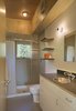 The entrance is immediately flanked on its left by a mudroom for hiking gear and the bathroom. Photo of Simple Cabin Embraces Its Mountain Setting modern home