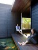 If good fences make good neighbors, then Shino and Ken Mori are the best neighbors ever. For our story The Hidden Fortress, they invite us past the charred cedar facade of their walled-in, introverted Southern California home, the Wabi House, designed by architect Sebastian Mariscal. Here, Shino and Ken pull an Eames LCW chair for Herman Miller outside to enjoy their koi pond, which serves as a kind of front yard. Photo of 30+ Best Modern Fences modern home