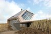 Using prefabricated materials for the exterior allowed Koehler and his team to drastically reduce building time during the construction phase. Cross-laminated timber panels (CLT), laser cut in the factory and assembled at the site within two weeks, add structure and aesthetic interest to the top of the home. Photo 3 of Dune House modern home