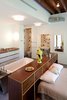 The bath was placed behind the bed, another example of the way the artist—who was accustomed to sleeping in the pool area of her previous apartment—likes to break down spatial boundaries and traditional designations of rooms. Photo of Unusual Sleeping Spaces modern home
