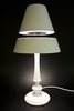 The Silhouette model comes with a wood base coated in glossy paint. Photo of Whimsical Floating Lamps modern home