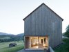 The lattice shell was hewn from silver fir sourced from a nearby forest. Eternit shingles clad the roof. Photo of House For Julia Björn modern home