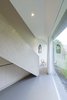 The architect minimized costs by keeping the detailing relatively simple. That naturally led to simple shapes and clean lines that enhance the home's minimalist feel. Photo 6 of Triangular House modern home