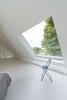 In the upstairs bedroom, a square skylight opens to a patch of sky. Photo 7 of Triangular House modern home