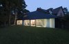 At night, residents can draw the curtains closed for privacy. Photo 8 of Triangular House modern home