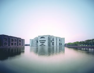 Originally meant as a Pakistani government building, Kahn's monumental design became the seat of the government of Bangladesh when the country split in two. It's as bold and commanding a symbol of young democracy as the world has ever seen; eight concrete modules envelop a center space cloaked in white marble, while the surrounding artificial lake provides natural cooling and a dramatic backdrop.