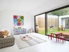 The cozy “rumpus room,” a kids playroom that functions as a second living room, looks out onto the courtyard. The space was designed to encourage kids’ creativity, while complementing adult tastes. With the addition of a movable wall, the space can be sectioned off so children can be seen but not heard. Functional and durable white cork flooring completes the child-friendly space. Photo 3 of 1850s Prefab Cottage from Boston Finds New Life in Australia modern home