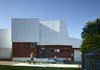 “The stained plywood base was used as a way to ground the house and allow the rendered, expanded polystyrene folding façade to float above,” O’Neill said. Specifically, that wood base is SHADOWclad by Carter Holt Harvey Woodproducts Australia. Photo of Annie Street modern home