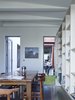In keeping with the overall objective to maximize light coming into the home, O’Neill and the owners wanted to keep the interior design minimal. Therefore, all of the walls were painted a cool Windy Beach shade by Taubmans. Photo 4 of Annie Street modern home