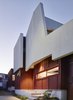 “At the front door, the house is only six feet wide and opens to the north-facing landscape behind, providing views out and allowing light in,” O’Neill said. The home’s uniquely-shaped roof is painted with Taubmans’ Crisp White. Photo 8 of Annie Street modern home