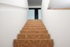 Cork staircases connect each floor of the house, while adding warmth and texture to the home's neutral palette. Photo 8 of Ferrum House modern home