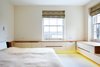 Light wooden storage cabinets line the walls of the upper bedrooms. Photo 8 of Lantern Home modern home